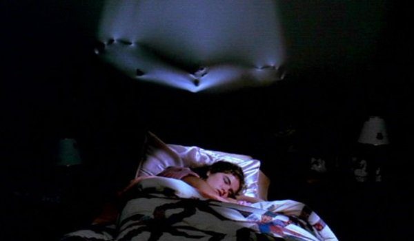 neumorphism demonstrated with a movie still form A Nightmare on Elm Street of Freddie Krueger emerging from Nancy's bedroom wall
